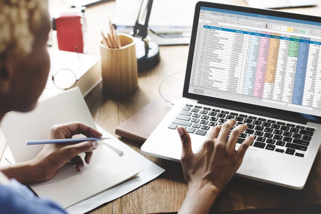 a woman is working on a dataset